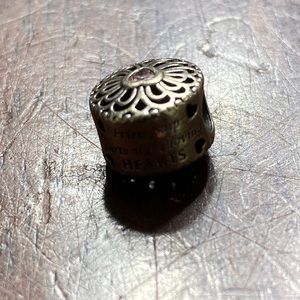 Friend charm. Some of the writing on sides are worn